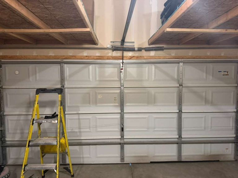 Dor, ASAP technician replacing a garage door torsion spring